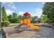 Community playground with a colorful slide and climbing structure, perfect for Gathering fun and outdoor activities at 5478 Somer Mill Rd, Douglasville, GA 30134