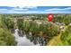 Stunning aerial view of the homes with a private lake, wooden dock and surrounding lush greenery at 6351 Granbury Nw Walk, Acworth, GA 30101