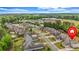 Wonderful aerial view of the homes in a lovely neighborhood showcasing manicured lawns and mature trees at 6351 Granbury Nw Walk, Acworth, GA 30101