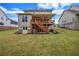 Large backyard featuring a deck with stairs, and plenty of green space at 6351 Granbury Nw Walk, Acworth, GA 30101