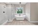 Bathroom featuring white soaking tub and walk-in shower at 6351 Granbury Nw Walk, Acworth, GA 30101