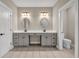 Bright bathroom featuring a dual sink vanity with oval mirrors and updated fixtures at 6351 Granbury Nw Walk, Acworth, GA 30101