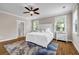 Inviting bedroom with a plush bed, ceiling fan, and lots of natural light at 6351 Granbury Nw Walk, Acworth, GA 30101