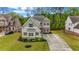 Charming two-story home with manicured lawn and long driveway at 6351 Granbury Nw Walk, Acworth, GA 30101
