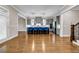 Spacious kitchen adjacent to living room with center island, counter seating and pendant lights at 6351 Granbury Nw Walk, Acworth, GA 30101
