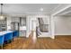 Open-concept living room with hardwood floors and a view of the modern kitchen at 6351 Granbury Nw Walk, Acworth, GA 30101