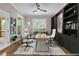 Staged office with hardwood floors, built-in bookshelves, and a view of the porch at 6351 Granbury Nw Walk, Acworth, GA 30101