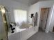 Bright bathroom featuring a garden tub, shower, and linen closet at 2122 Riverbirch Ct, Lawrenceville, GA 30044