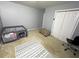 Bedroom with a play area, a rug, an ottoman, and a closet at 2122 Riverbirch Ct, Lawrenceville, GA 30044