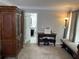 Bedroom featuring neutral decor and desk, adjacent to bathroom at 2122 Riverbirch Ct, Lawrenceville, GA 30044