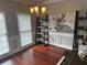 Charming dining area featuring a stylish chandelier, lovely art, and a keyboard at 2122 Riverbirch Ct, Lawrenceville, GA 30044