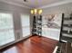 Beautiful dining room with natural light, statement chandelier, and a decorative painting at 2122 Riverbirch Ct, Lawrenceville, GA 30044