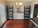 Elegant dining room showcasing hardwood floors, stylish shelving, and a piano at 2122 Riverbirch Ct, Lawrenceville, GA 30044