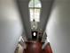 Two-story foyer with hardwood floors and an elegant light fixture at 2122 Riverbirch Ct, Lawrenceville, GA 30044