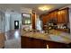 Spacious kitchen featuring granite countertops, wood cabinetry, and modern appliances at 2122 Riverbirch Ct, Lawrenceville, GA 30044