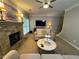 Relaxing living room showcasing a stone fireplace, comfortable seating, and stylish lighting at 2122 Riverbirch Ct, Lawrenceville, GA 30044