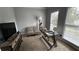 Cozy office space with natural light, neutral tones, and a comfortable seating area at 2122 Riverbirch Ct, Lawrenceville, GA 30044