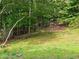 Lush backyard featuring mature trees, ample green space, and a peaceful, private setting at 2122 Riverbirch Ne Ct, Lawrenceville, GA 30044