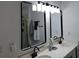 Bright bathroom features a double vanity, granite countertops and modern lighting, enhancing a clean aesthetic at 2122 Riverbirch Ne Ct, Lawrenceville, GA 30044