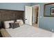 Comfortable bedroom with a view of the doorway to a carpeted staircase at 2122 Riverbirch Ne Ct, Lawrenceville, GA 30044