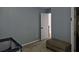 Bedroom features a small playpen and ottoman at 2122 Riverbirch Ne Ct, Lawrenceville, GA 30044