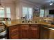 Kitchen featuring a sink island, granite countertop, stainless steel appliances, wooden floors and cabinets at 2122 Riverbirch Ne Ct, Lawrenceville, GA 30044