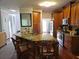A spacious kitchen with granite countertops, wooden cabinets, and stainless steel appliances provides charm and functionality at 2122 Riverbirch Ne Ct, Lawrenceville, GA 30044