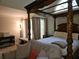 Luxurious main bedroom with a four poster bed, elegant decor and lots of natural light at 2122 Riverbirch Ne Ct, Lawrenceville, GA 30044