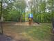 Residential playground with swings and a slide, set against a backdrop of green trees at 2122 Riverbirch Ne Ct, Lawrenceville, GA 30044