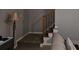 Carpeted staircase with wooden railing detail adds to the welcoming feel of this home at 2122 Riverbirch Ne Ct, Lawrenceville, GA 30044