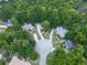 An aerial view of the neighborhood surrounded by mature trees at 405 Sable Trace Cv, Acworth, GA 30102