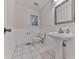 Cozy bathroom features tile flooring, sink, toilet, vanity mirror, and window at 405 Sable Trace Cv, Acworth, GA 30102