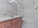 Clean bathroom featuring tile flooring, tub, sink, and wood vanity at 405 Sable Trace Cv, Acworth, GA 30102