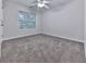 Cozy bedroom with plush carpeting, ceiling fan, and window for natural light at 405 Sable Trace Cv, Acworth, GA 30102