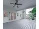 Back deck showing doors to house with ceiling fan at 405 Sable Trace Cv, Acworth, GA 30102