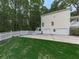 Rear exterior view of house with two car garage, fenced yard and lawn at 405 Sable Trace Cv, Acworth, GA 30102