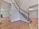 Open foyer with hardwood floors, staircase, and a view of the living and dining areas at 405 Sable Trace Cv, Acworth, GA 30102