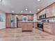 Charming kitchen with stainless steel appliances, a center island, and plenty of cabinet space at 405 Sable Trace Cv, Acworth, GA 30102