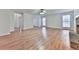 Spacious living room showcasing hardwood floors, neutral paint, and ample natural lighting at 405 Sable Trace Cv, Acworth, GA 30102