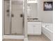 Bathroom features a separate shower, bathtub and vanity area at 420 Bear Cub Path, Social Circle, GA 30025