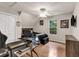 This bedroom features a window, closet, ceiling fan, and flexible workspace area with modern desk at 420 Bear Cub Path, Social Circle, GA 30025
