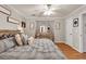 Bright main bedroom featuring a mirror, wooden furniture and natural lighting at 420 Bear Cub Path, Social Circle, GA 30025
