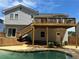 Spacious backyard featuring a refreshing swimming pool and a two-story deck with stairs at 4811 Nevilly Way, Marietta, GA 30066