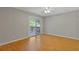 A bedroom with sliding glass doors leading to a deck and hardwood floors at 4811 Nevilly Way, Marietta, GA 30066