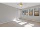 Bedroom featuring multiple windows, carpeted floors, and a neutral color scheme at 4811 Nevilly Way, Marietta, GA 30066
