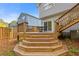 Multi-level wooden deck with steps, offering a transition from the house to the yard at 4811 Nevilly Way, Marietta, GA 30066
