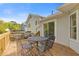 Relaxing outdoor deck with table and chairs, ideal for enjoying meals near the house at 4811 Nevilly Way, Marietta, GA 30066