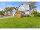 Two-story home featuring light gray siding, front yard, garage and a wood deck at 4811 Nevilly Way, Marietta, GA 30066