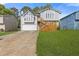Two-story home featuring light gray siding, front yard, garage and a wood deck at 4811 Nevilly Way, Marietta, GA 30066