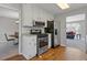 Kitchen featuring stainless steel appliances, white cabinets, and tile backsplash at 4811 Nevilly Way, Marietta, GA 30066